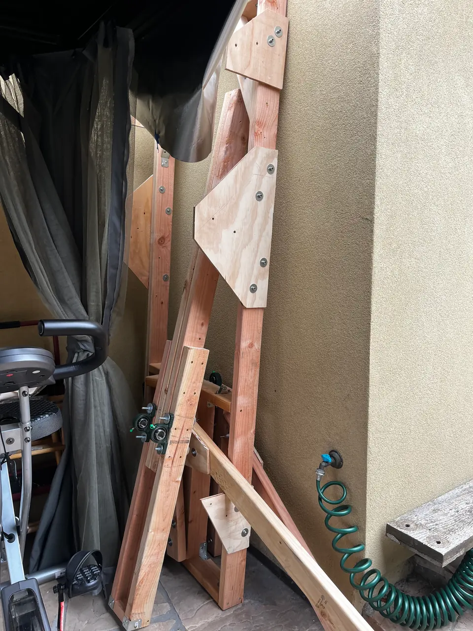 Frame pieces with plywood gussets and pillow-block bearings