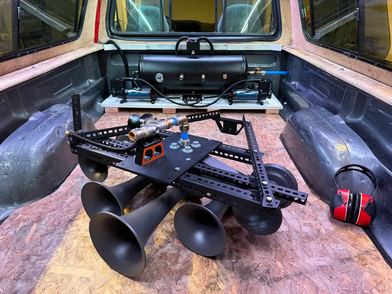 Horns on the cage, with the tank and dual compressors bolted into the bed