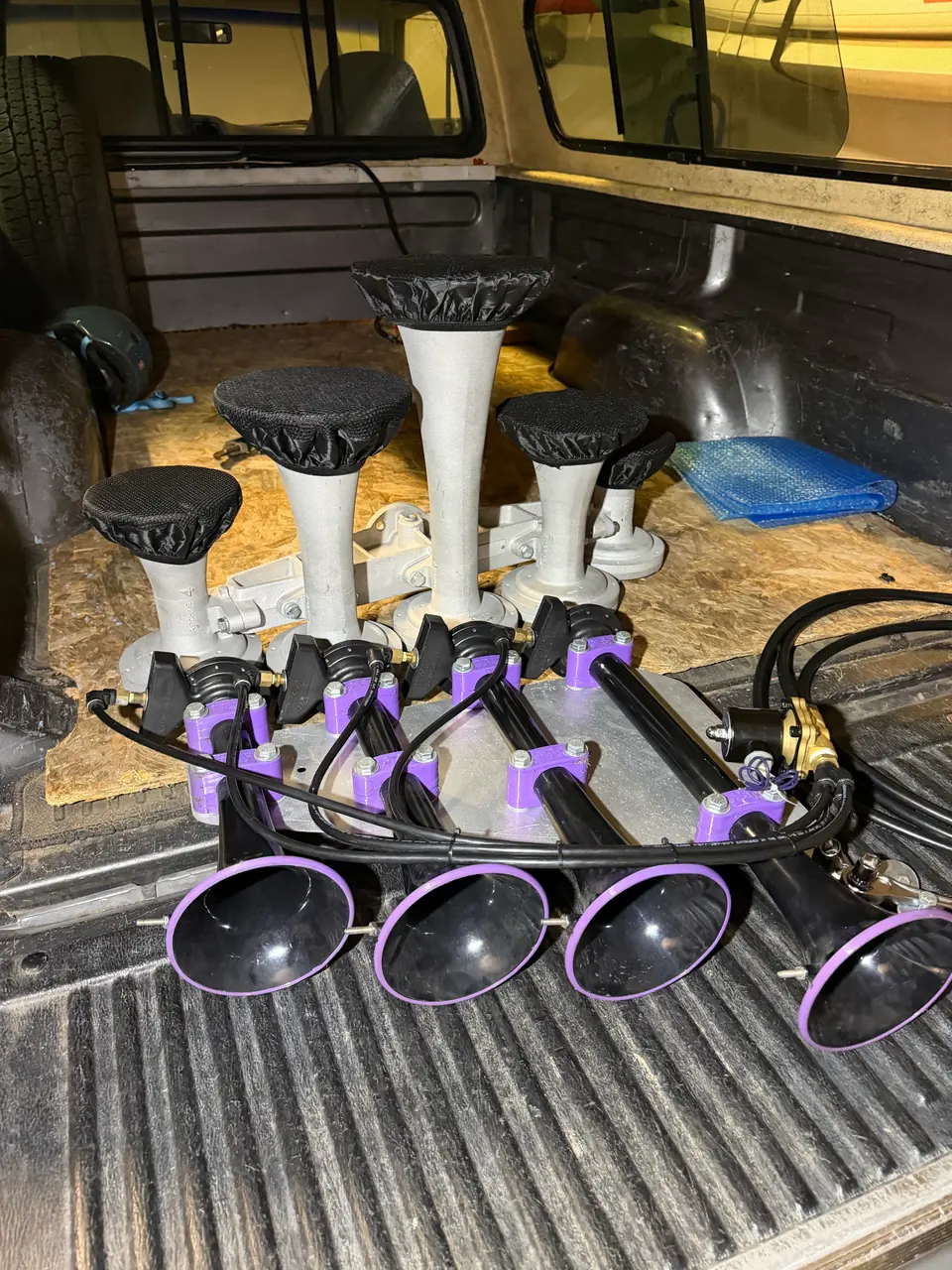 The K5LA in the truck bed, next to my semi-truck horns