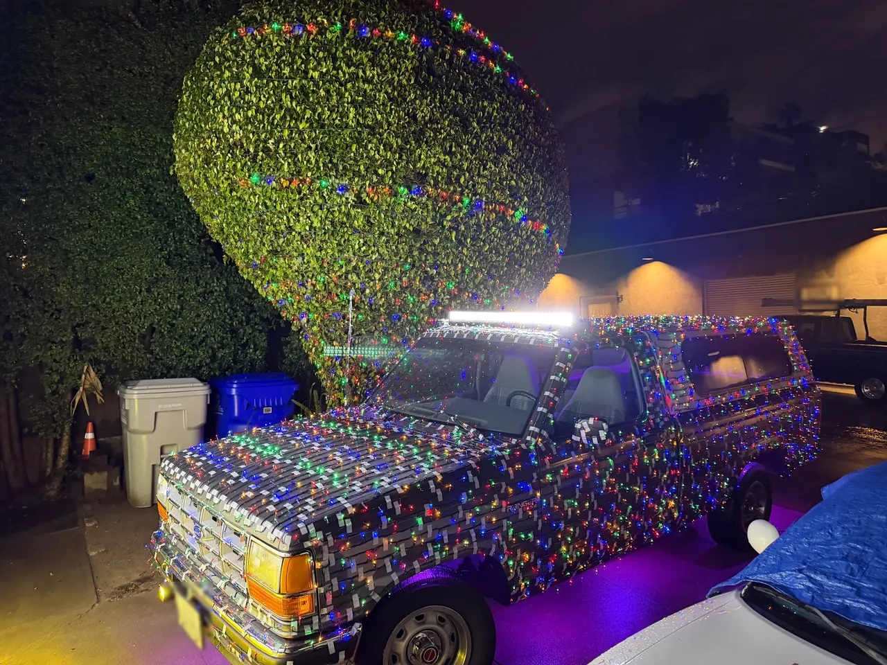On the Ranger’s cab roof at night, with the truck wrapped in holiday lights