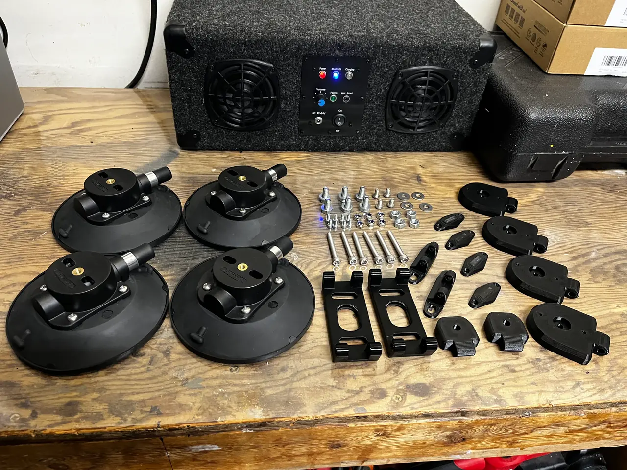 Suction cups, printed parts and hardware before assembly