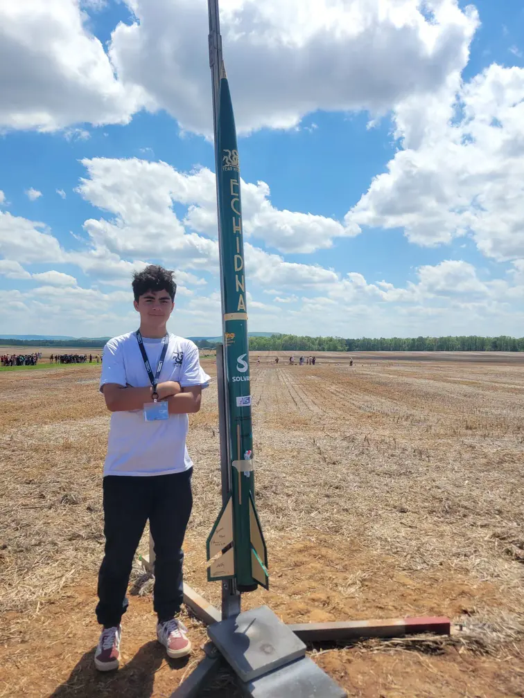 Me with the rocket on launch day, April 2023