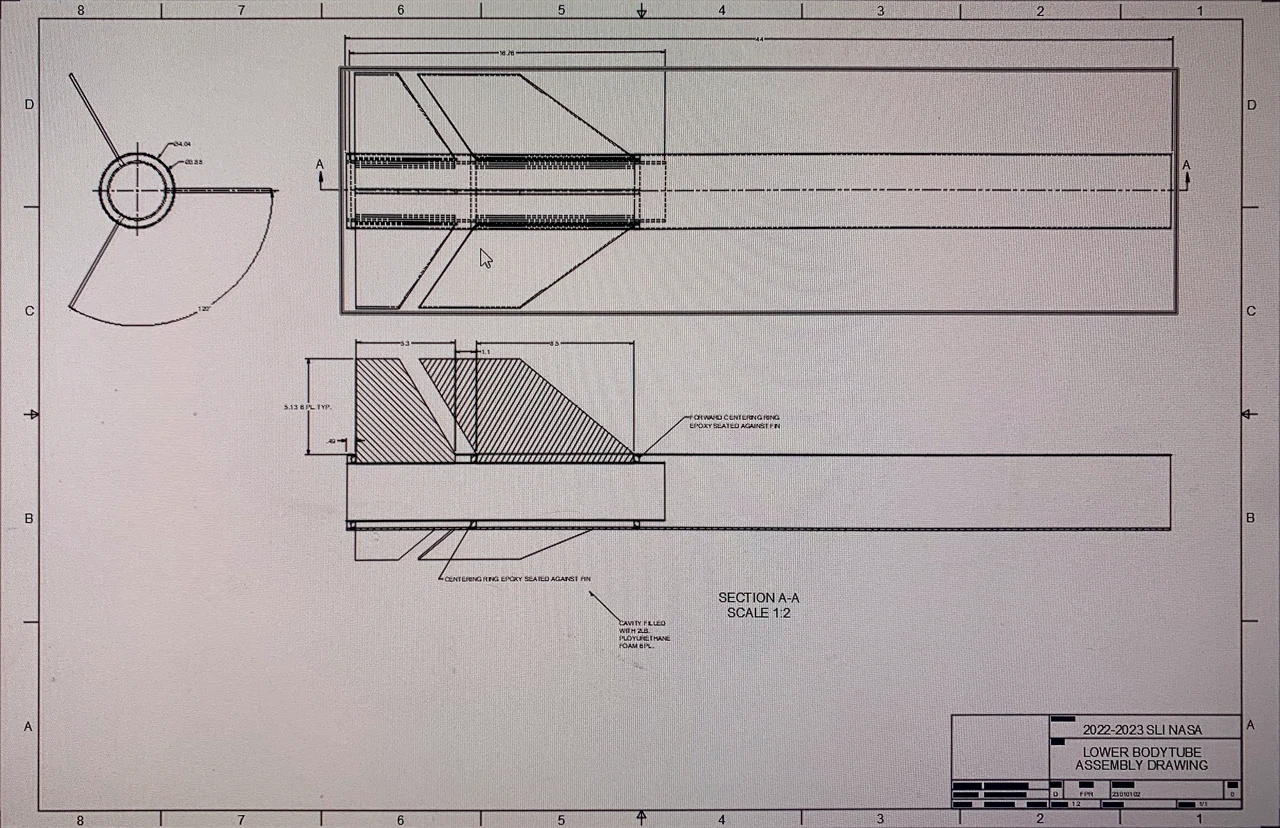 Lower body tube assembly drawing: fins, centering rings and a dimensioned section view