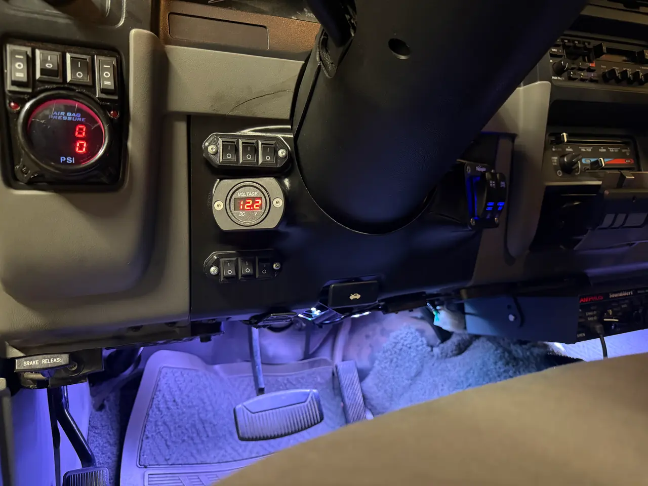 Closer in: two rows of switches and the voltage gauge