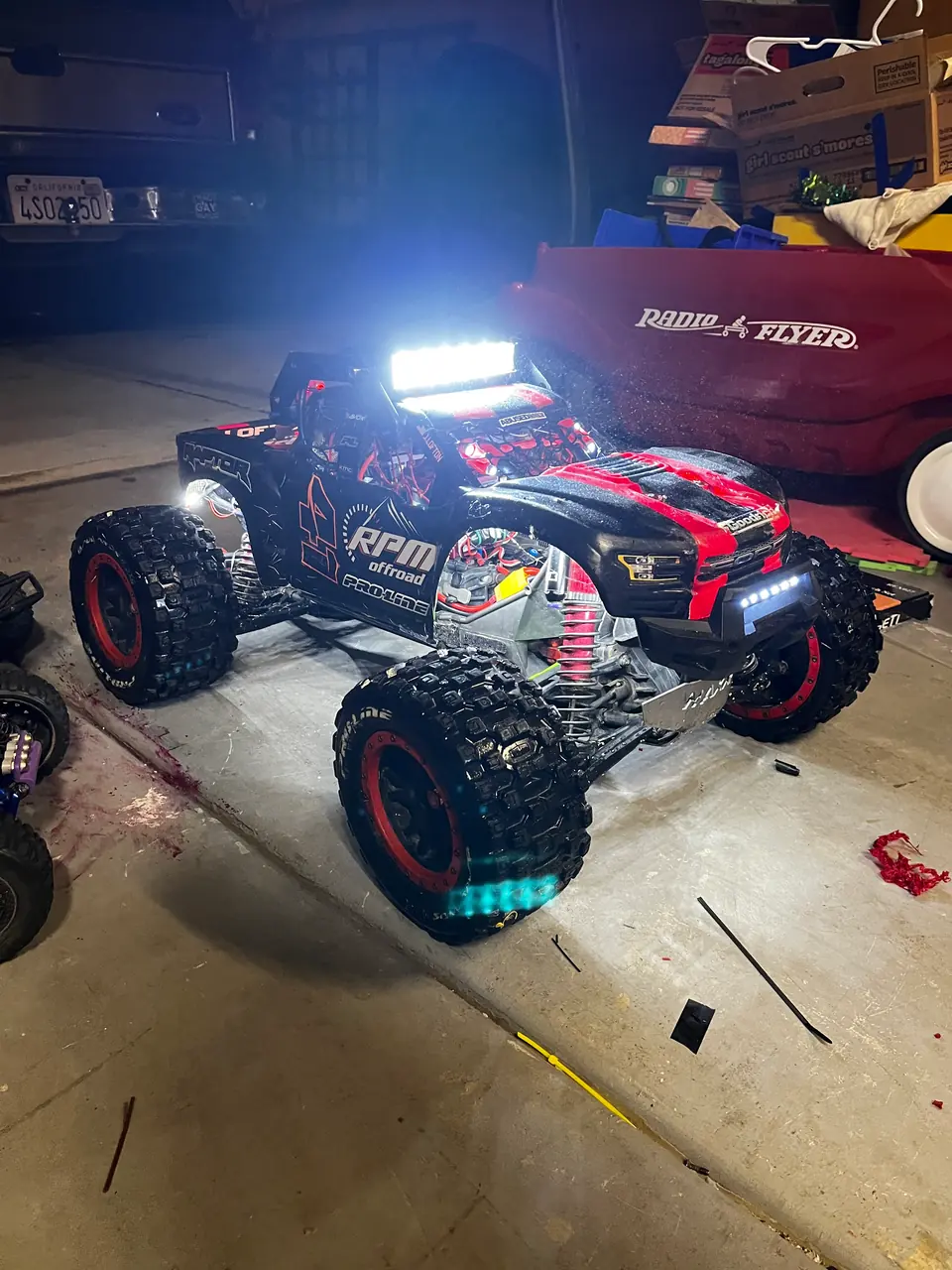 The X-Maxx with its lights on