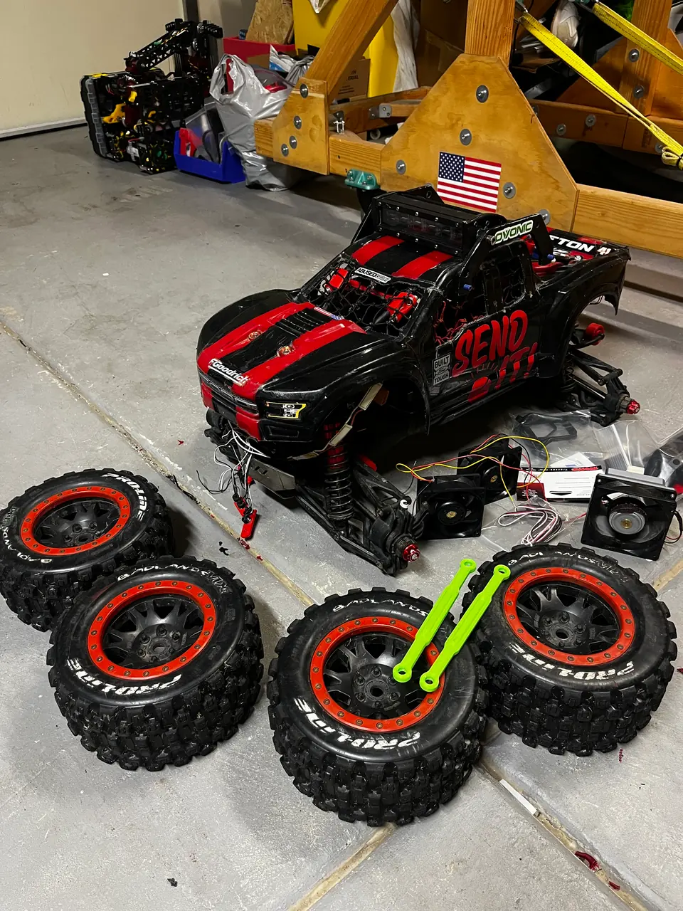 Printed link arms, in green, during wheel and suspension work
