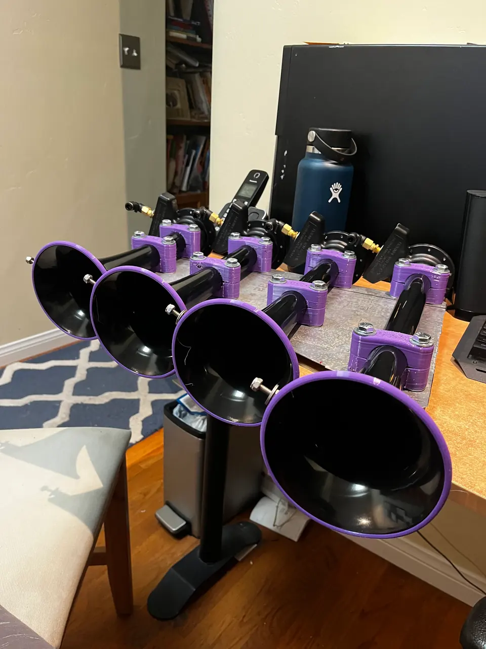 The four horns on the mounting plate I made, with the purple TPU parts