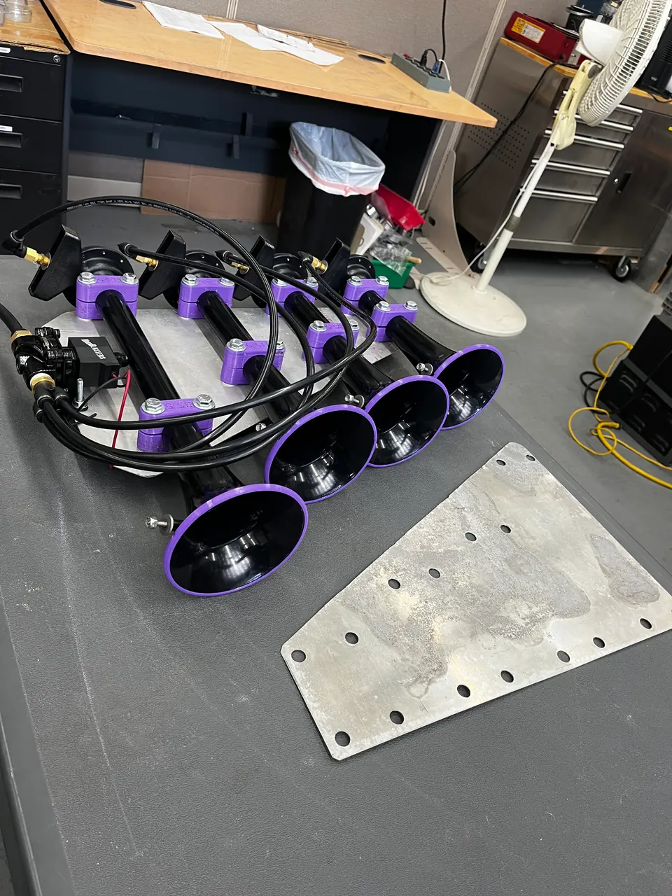 The horns next to the sheet-metal mounting plate