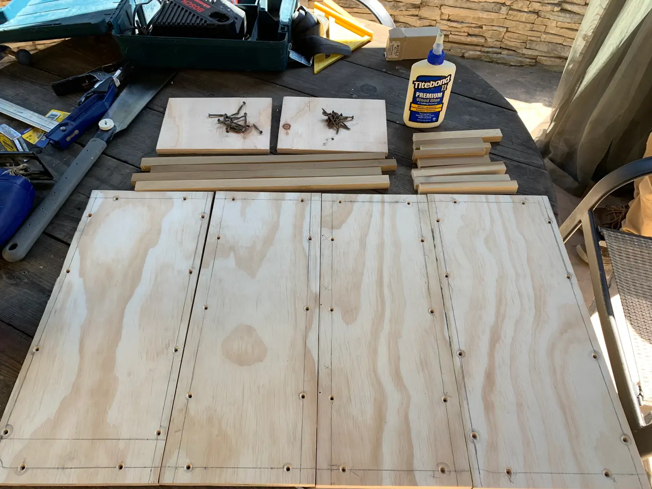 Plywood panels and frame pieces, cut and laid out